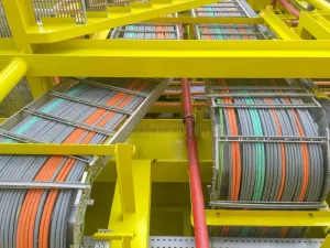 oil-gas-industry-high-voltage-electrical-cables-layout-cable-tray-yellow-steel-structure-platform-109892676